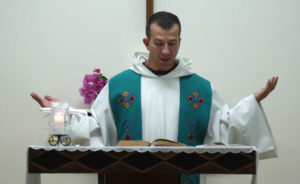 Chaplain Santo Cricchio giving his first mass in French at a Catholic mission in Arta, Djibouti.  Cricchio was requested to assist in a shortage of priests in the area by the Catholic Bishop of Somalia.